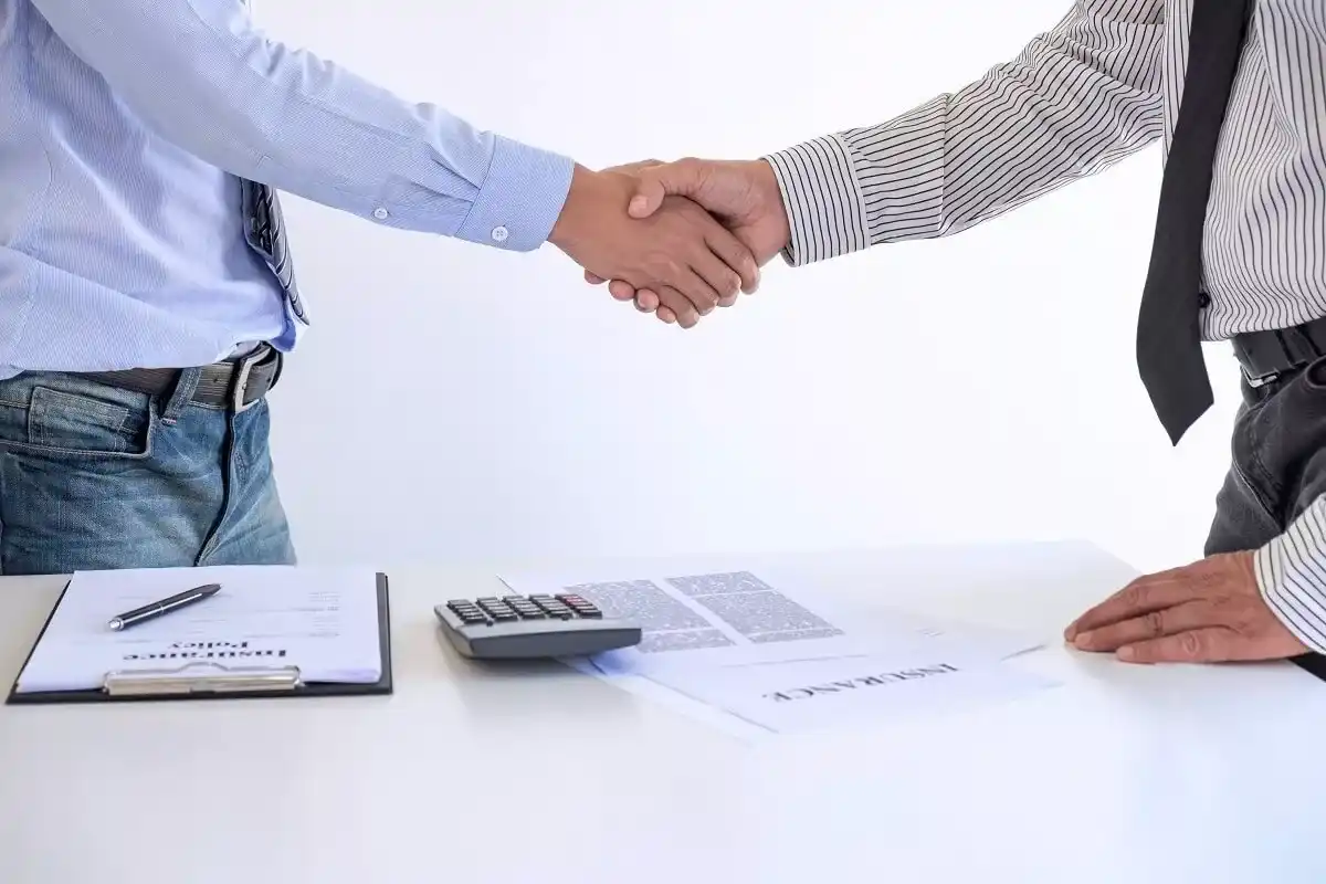 two men shakehands after successful agreement